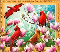 Красные птицы на ветках магнолии