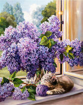 Цветущая сирень и котенок с сиреневым клубком на подоконнике