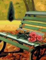 Три розы на лавочке в осеннем парке