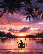 Девушка на качели с видом на океан