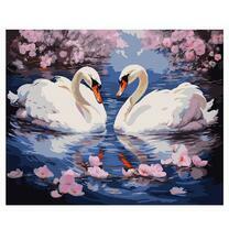 Белые лебеди на водной глади озера