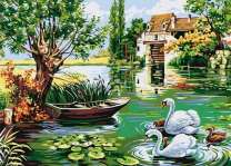 Семья лебедей у домика на озере