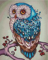 Сова на ветке дерева