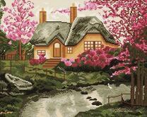 Домик с серой крышей и цветущие деревья