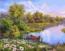 Лодка на берегу ромашковой поляны