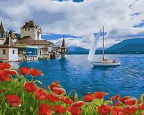 Маковое поле и деревня у моря