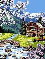 Деревянный домик у подножья гор