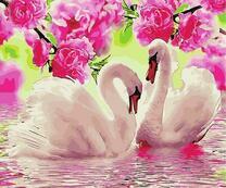 Лебеди на озере под цветами