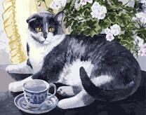 Красивый кот и чайная чашка