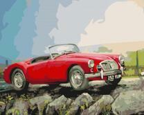 Красный спортивный автомобиль на скале