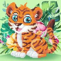 Милый тигренок в тропических цветах