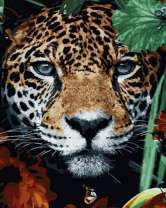 Леопард в цветах и зелёных листьях