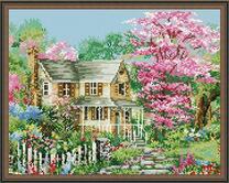 Дом в весеннем саду и цветущие деревья