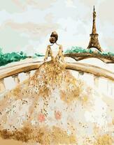 Девушка в роскошном платье на фоне Эйфелевой башни
