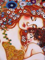 Рыжеволосая женщина с малышом