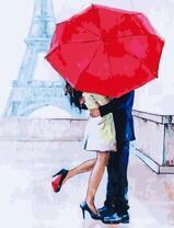 Нежный поцелуй под зонтом в Париже