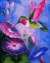 Колибри у ярких цветов