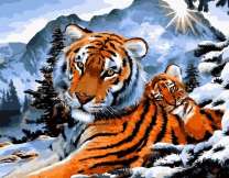 Тигрёнок с тигрицей в зимних горах