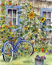 Велосипед у стены из цветов