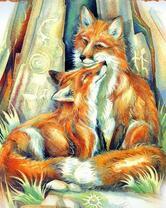 Пара влюбленных лисичек у пещеры