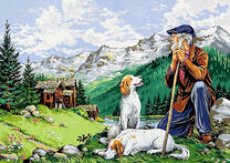 Дедушка пастух с собаками среди гор