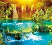 Семья лебедей на озере с водопадами