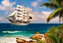 Большой белый парусник у тропического острова