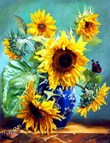 Красивые подсолнухи в синей вазе