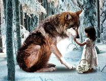 Девочка кормит волка в зимнем лесу