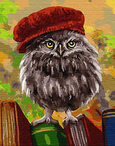 Круглый совенок на книгах