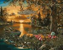 Пикник у осеннего озера на закате дня