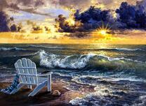 Шезлонг с книгой на берегу моря