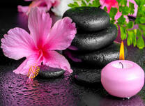 Цветок, свеча и камни