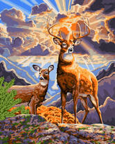 Олени среди гор в солнечных лучах