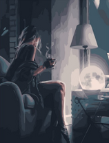 Девушка с чаем на мягком диване