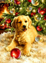 Щенок играет елочным шариком