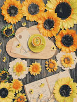 Подсолнухи, книга и капучино