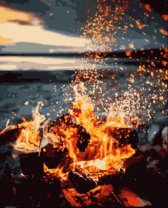 Яркие искры от огня у берега