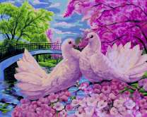 Пара белых голубей на цветущем дереве