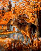 Олень у лесного домика осенью