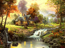 Домик из бруса у горного ручья