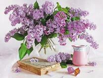 Букет сирени, книга и конфета