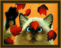 Смешной котёнок с осенними листьями