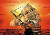 Парусник на фоне красного заката