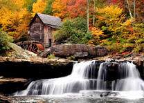 Водяная мельница в осеннем лесу