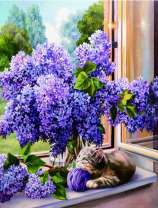 Котёнок под букетом сирени