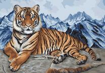 Тигр на фоне заснеженных скал