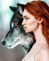 Рыжеволосая девушка и большой волк