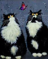 Два чёрно-белых кота и бабочка