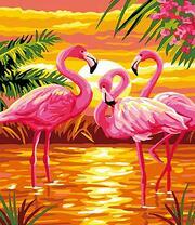 Три фламинго на фоне заходящего солнца